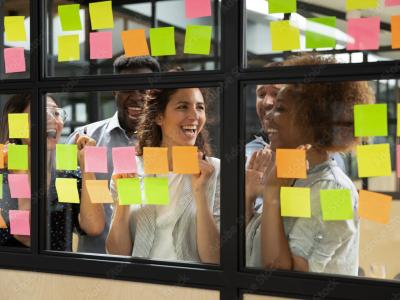 people working together with post its